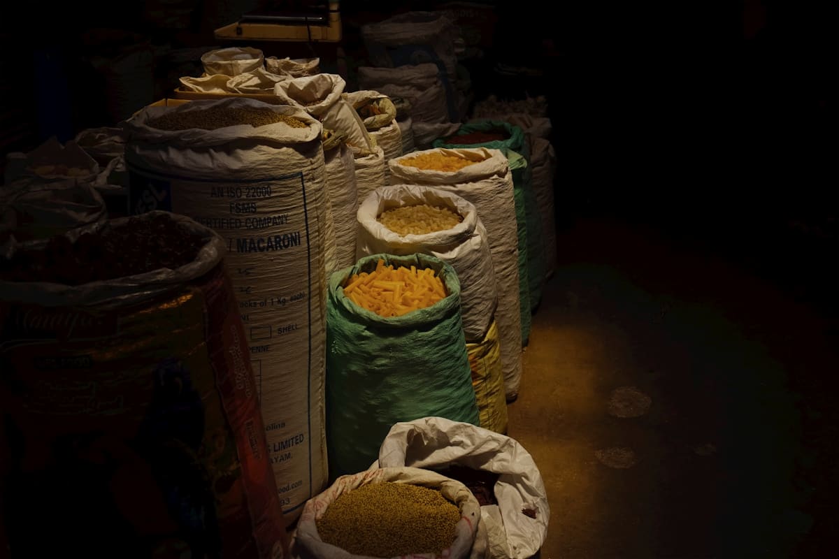 Rustic linen sacks in a sunlit storehouse